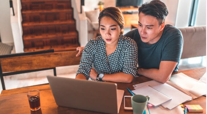 Couple checks their structured notes