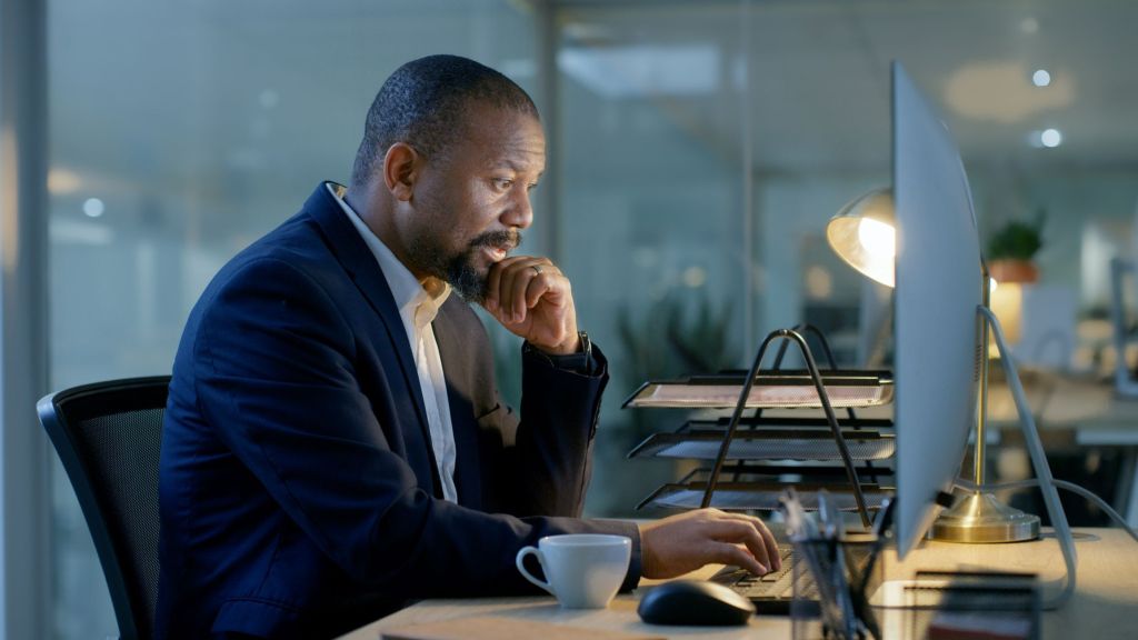 An investor researches dividend stocks to add to his long-term portfolio.