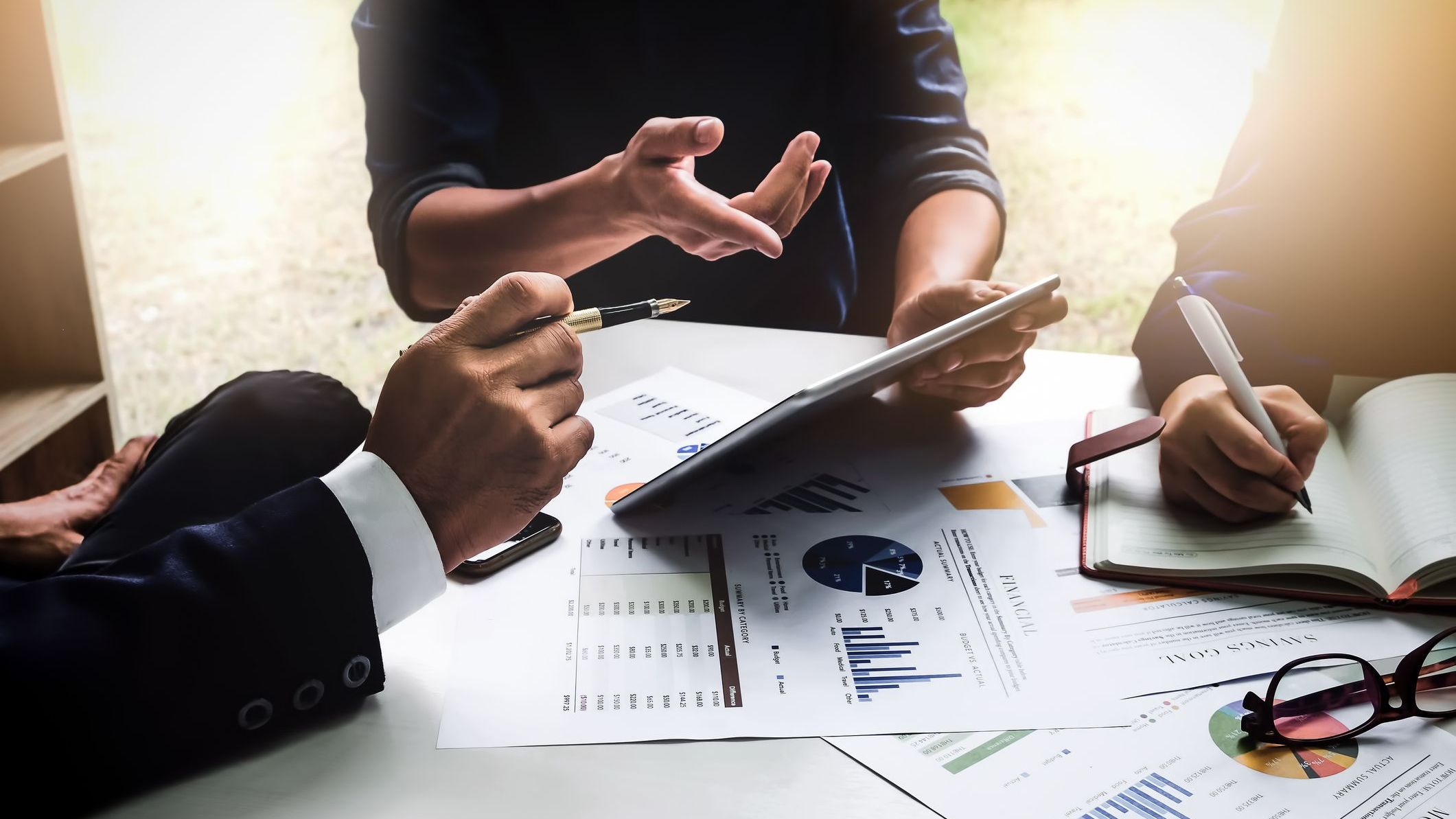 A company's financial management team planning and organizing their financial activities.