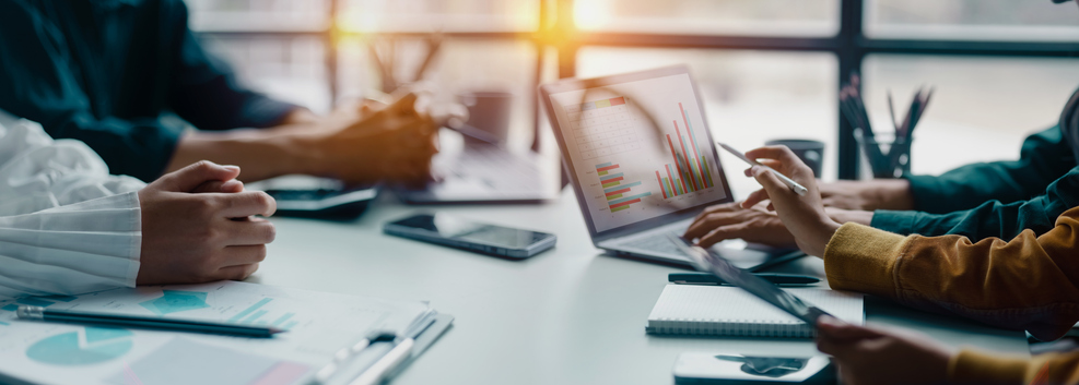 Financial advisors review growth strategies for their firm.