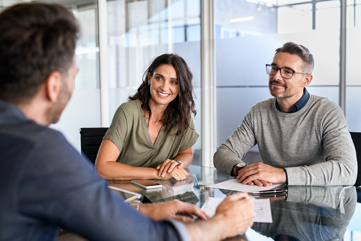 A financial advisor asks prospecting questions​ to new clients.