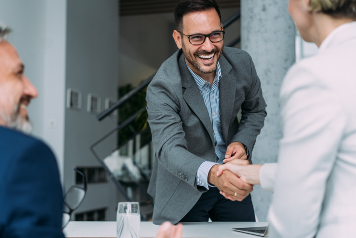 A financial advisor sits down with new clients.