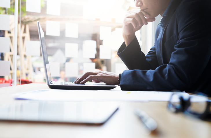A financial advisor works towards improving their online presence.