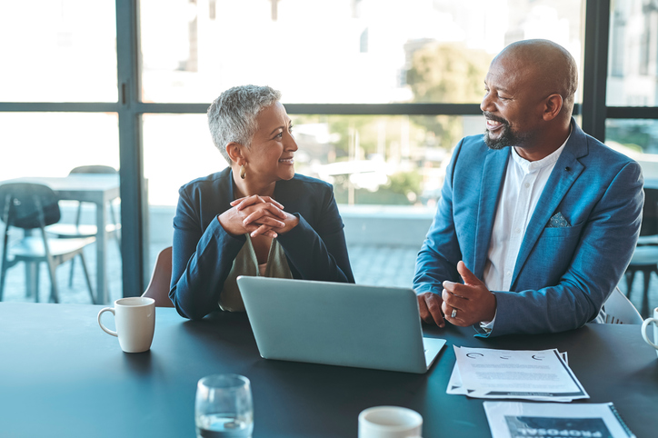 An advisor and coach discuss business development strategies.