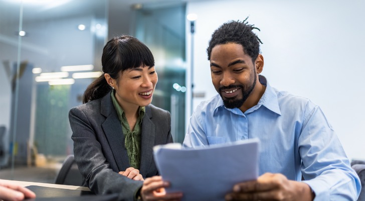Financial advisors discussing a new strategy to recruit estate planning clients.